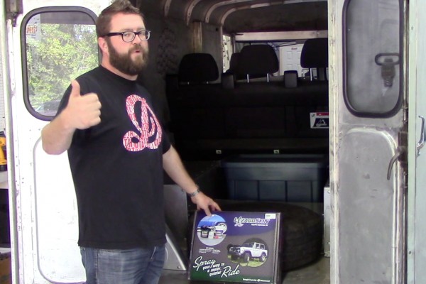 Rutledge wood near back of his delivery truck