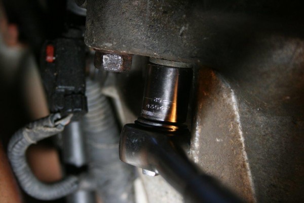 socket wrench on an engine bolt