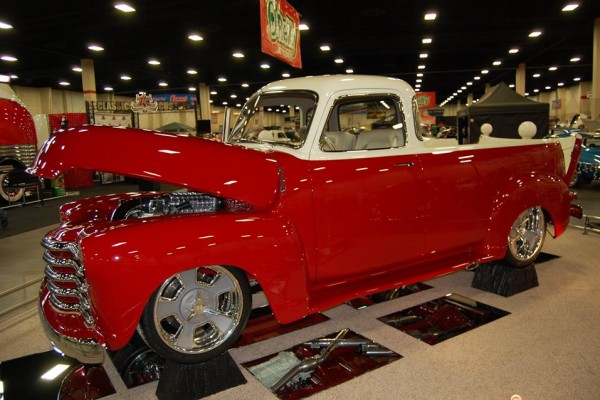 vintage truck with modern supercharged engine at indoor car show