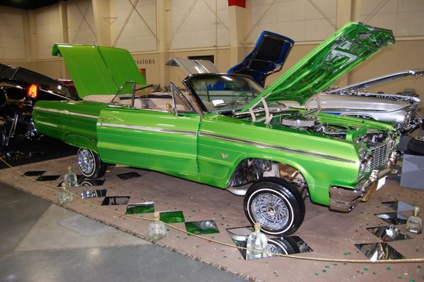 green lowrider chevy impala ragtop with hydraulics
