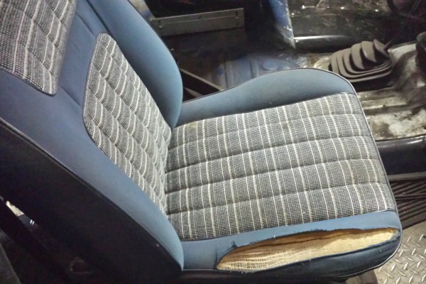old ratty seat in a ford bronco truck project car