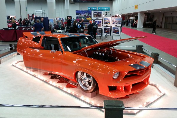 orange custom ford mustang show car on display