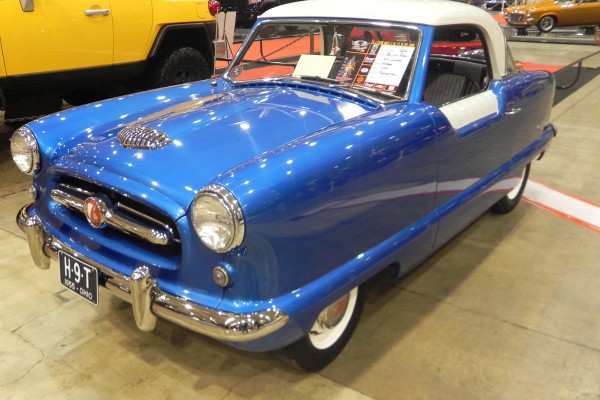 blue and white 1955 nash metropolitan hardtop coupe