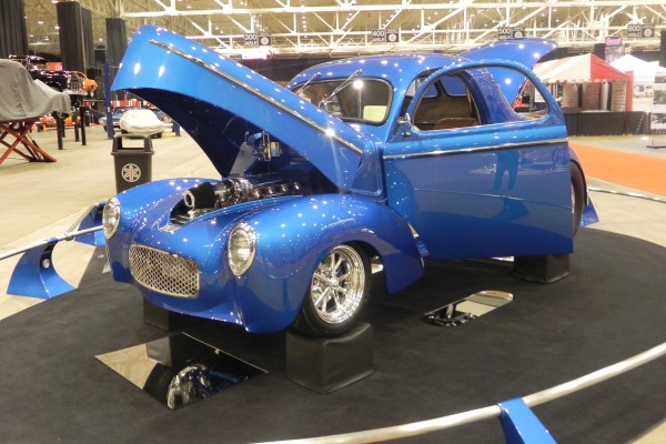 willys hot rod coupe on display at indoor car show