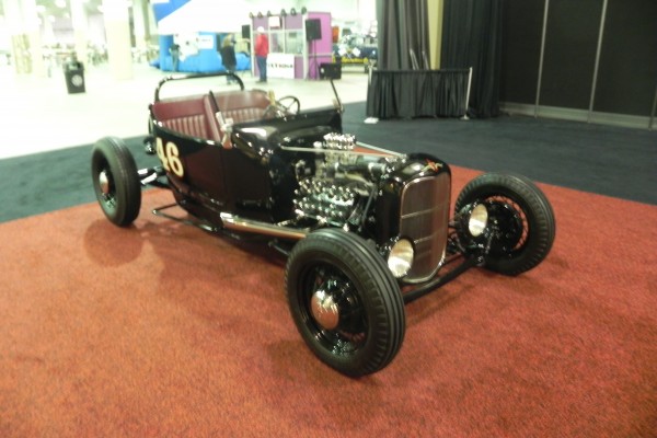 blurry picture of a t bucket hot rod