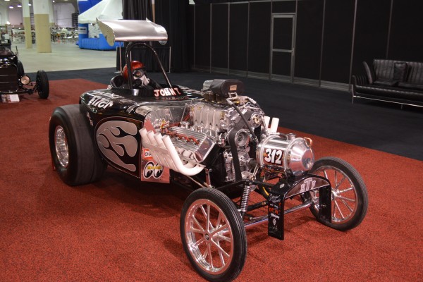 hemi powered nostalgia dragster on display at indoor car show