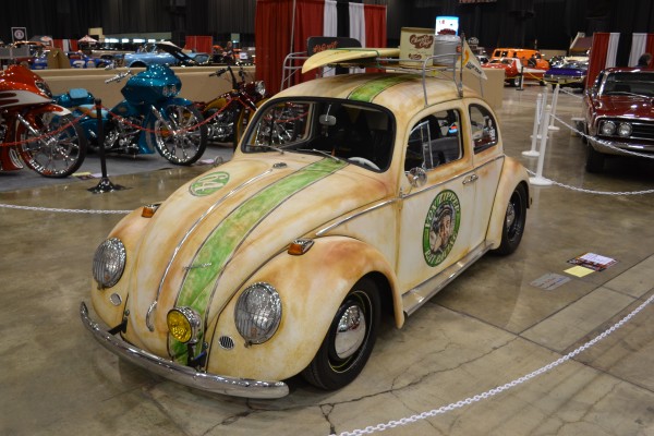 custom volkswagen beetle bug with a surf board