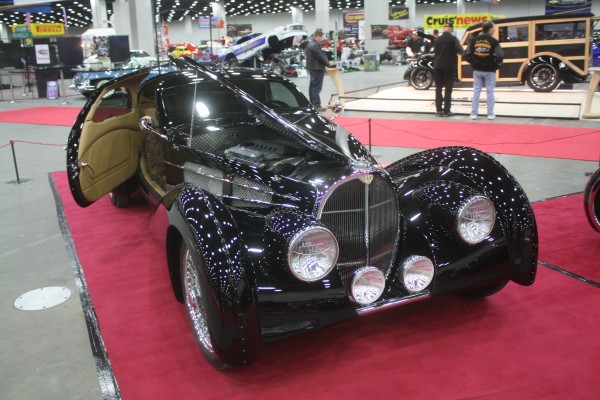 vintage European luxury coupe on display at indoor car show
