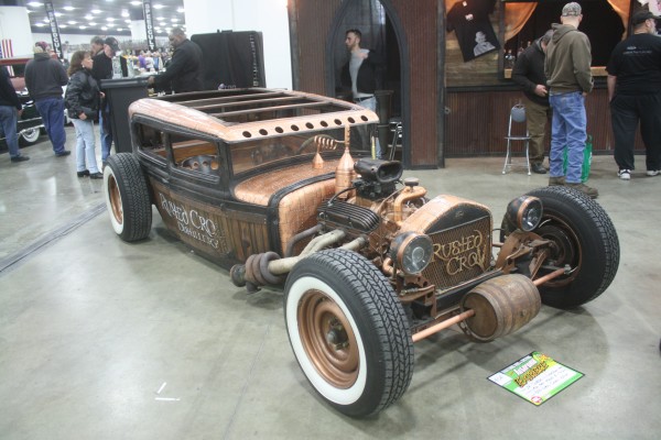 lowered moonshine-themed hot rod coupe at car show