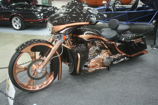 copper and black custom bagger style v twin motorcycle