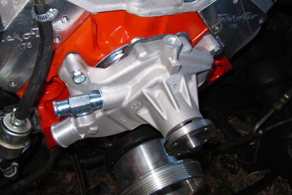 mechanical water pump installed on the front of a v8 engine