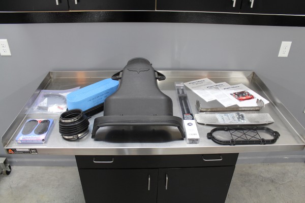 corvette z06 intake kit on a workbench