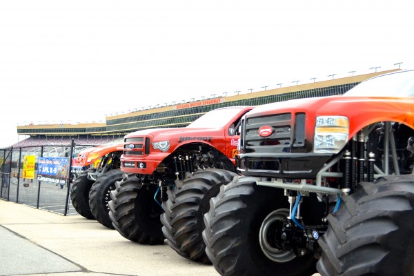 row of red bigfoot monster truck grilles