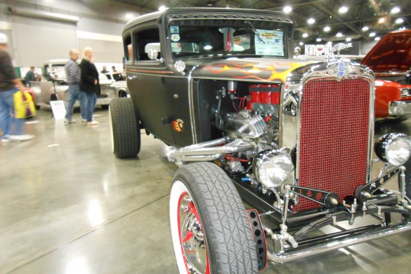 close up of the engine on a hot rod chevy coupe
