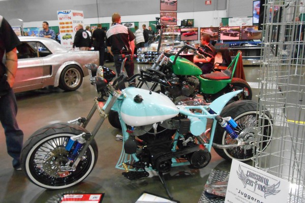 custom v-twin motorcycle displayed at indoor car show