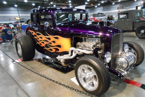 flamed for d 5 window hot rod displayed at indoor car show
