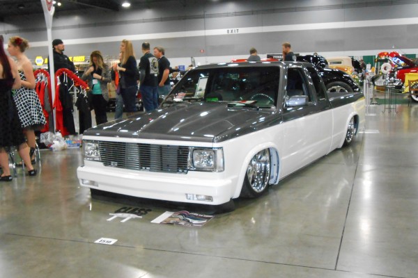 lowered chevy s10 truck displayed at indoor car show