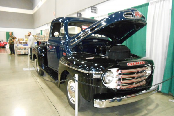 vintage mercury pickup truck displayed at indoor car show