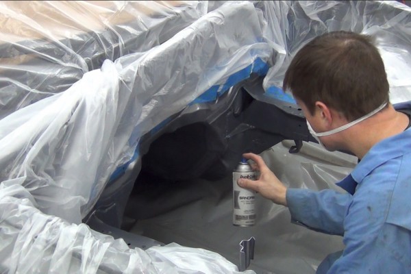 spray painting an engine transmission tunnel