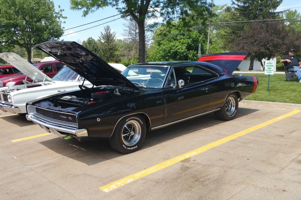 black 1968 dodge charger r/t with red bumble bee stripes