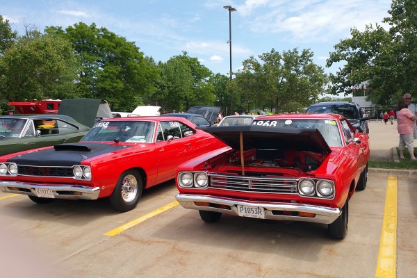 a row of classic mopars at a car show