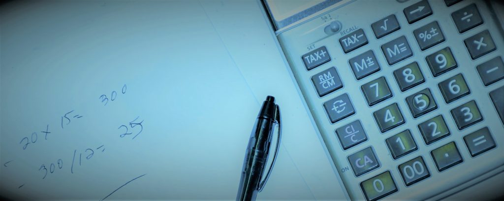 stylized photo of a notepad and calculator with handwritten calculations