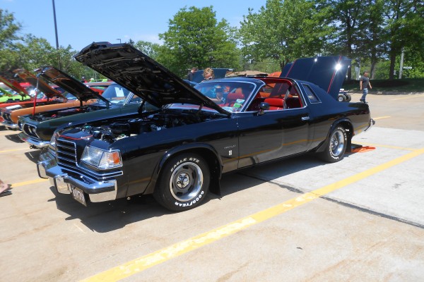 1979 plymouth valiant coupe with t tops at a classic car show