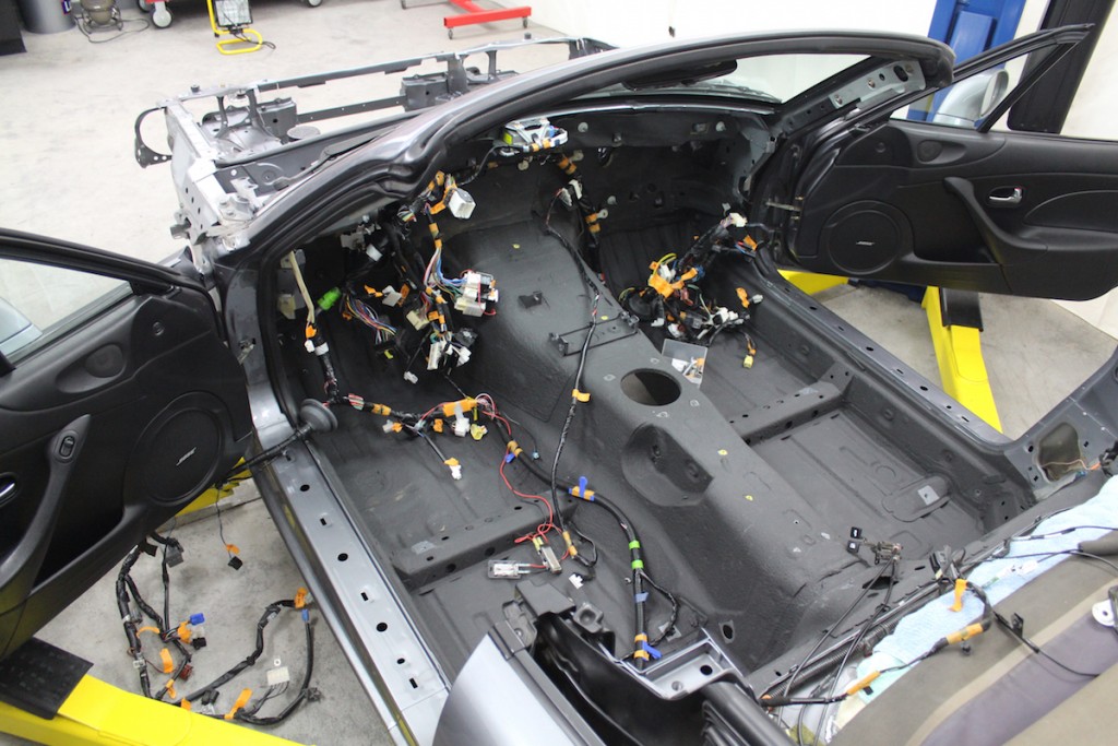 wiring harness laid out in a stripped race car interior