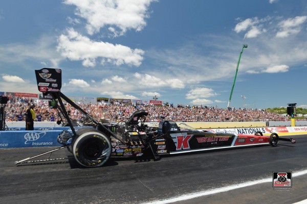 nhra top fuel dragster launching at the track