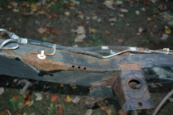 rusty jeep frame prior to restoration