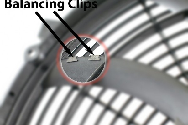 balancing clips on an electric fan blade