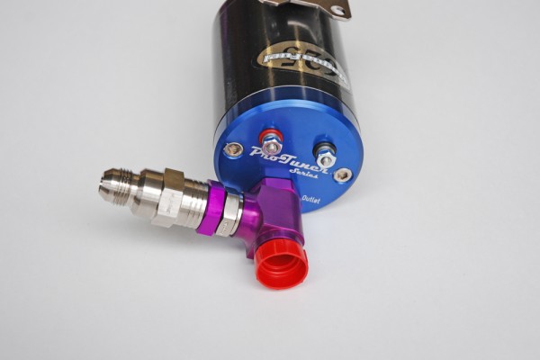 plumbing fittings on top of an electric vehicle fuel pump