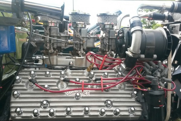 ford flathead engine with edelbrock heads in an old hot rod