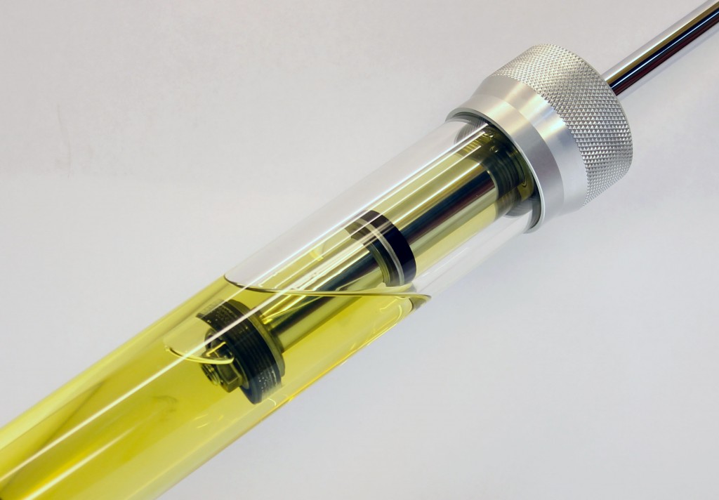 cutaway transparent view of oil inside a shock absorber