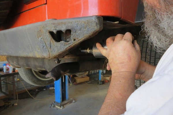 using an air hammer on rusty jeep bumper bolts