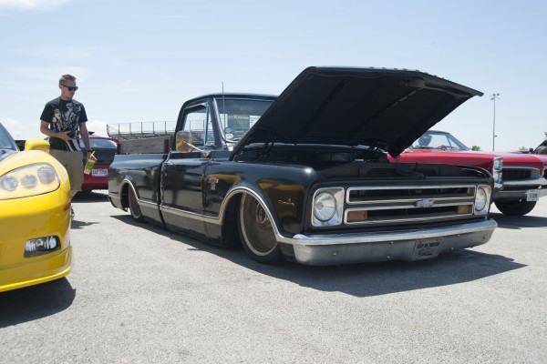 lowered chevy c10 truck at a car show