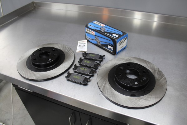 big brake rotors and pads upgrade kit on workbench