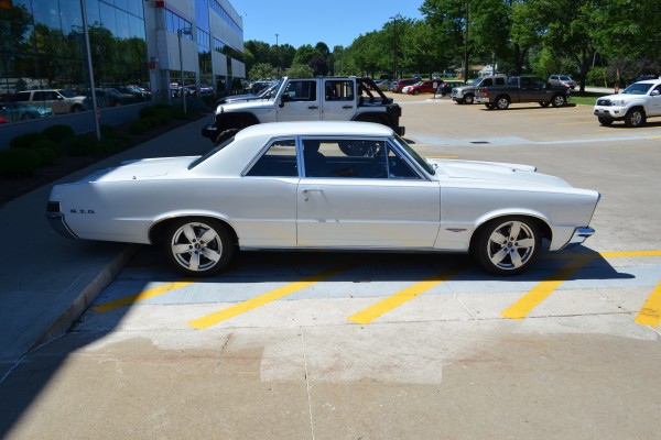 white 1965 pontiac GTO side profile view