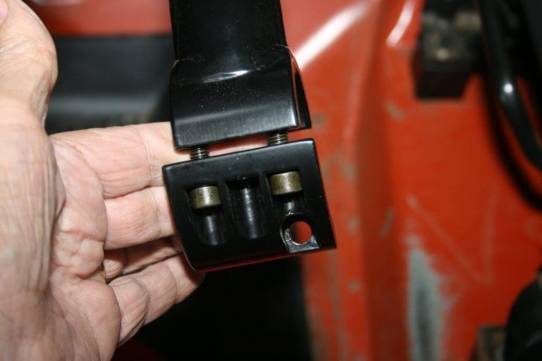 close up of aftermarket roll bar clamps and bolts