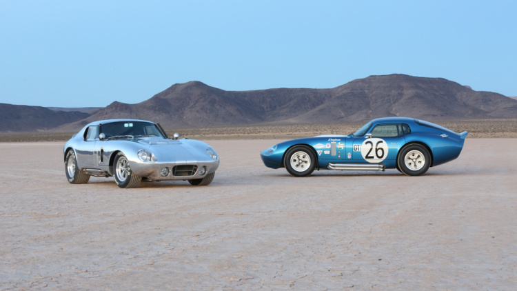 a pair of shelby datyona coupes in desert