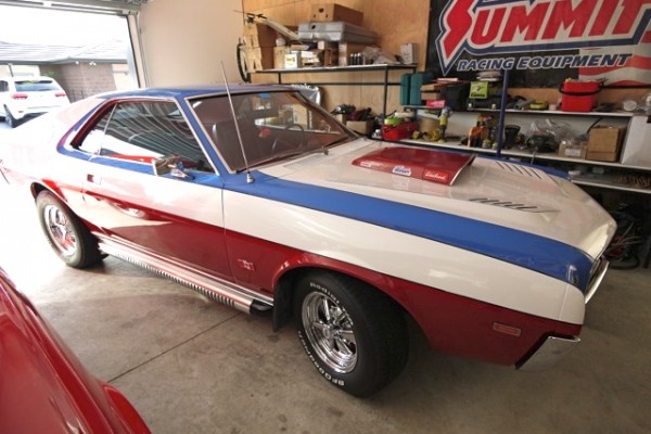amc amx muscle car in a home garage