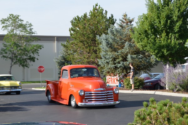 vintage chevy pickup truck entering summit racing cruise in