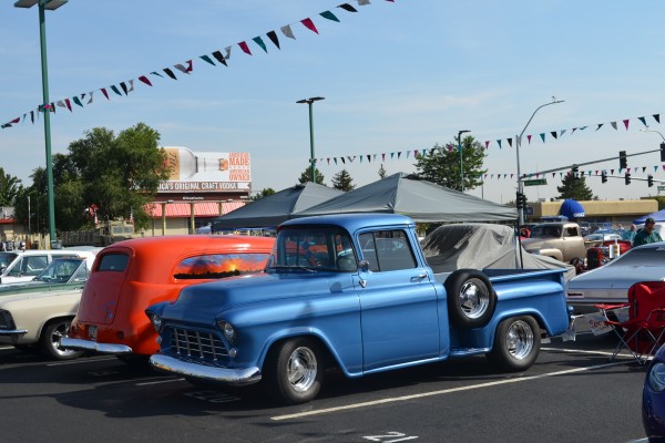 old cars and trucks at a local cruise in show