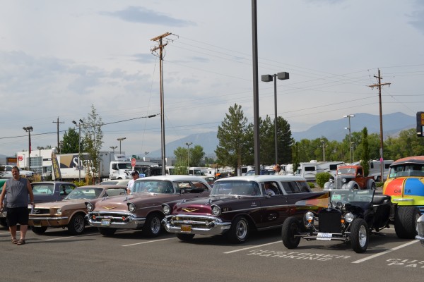 rows of classic cars at a show event