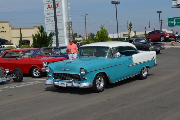 1955 chevy bel air coupe entering parking lot of car show