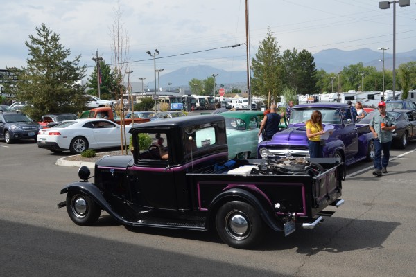 vintage jot rod truck driving in car show