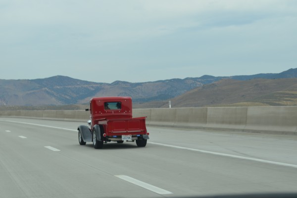 vintage hot rod pickup truck on desert highway