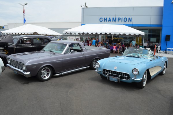 a ford ranchero and a c1 corvette at a classic car show
