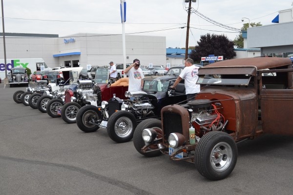 rows of hot rods at a car show