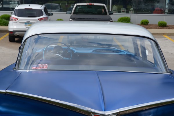 rear window of a vintage chevy sedan